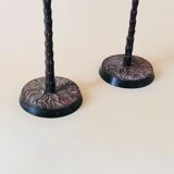Pair of patinated metal candlesticks