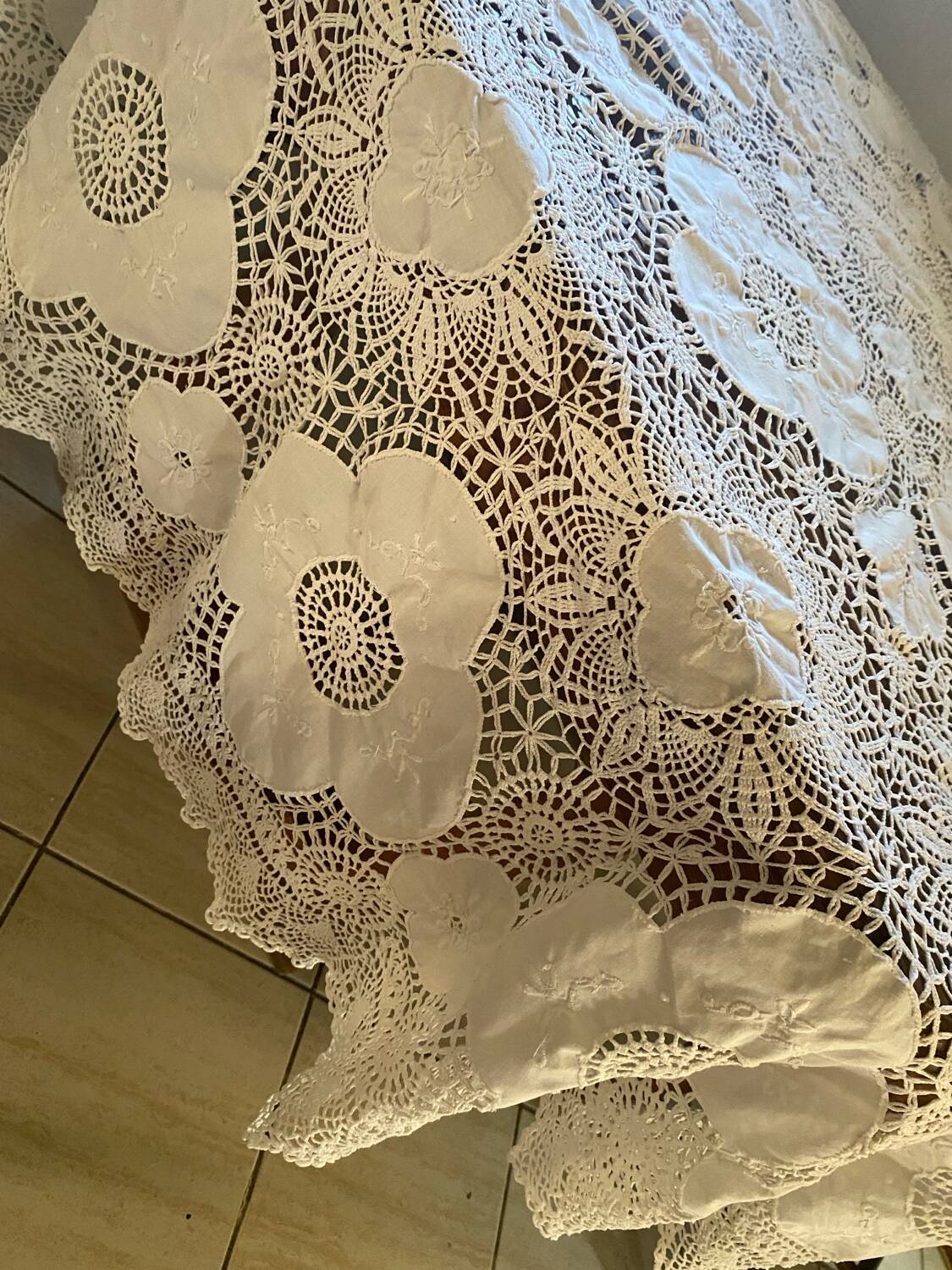 White cotton tablecloth with crochet lace.