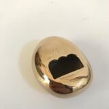 Bottle opener roller in gilded bronze by Monique Gerber