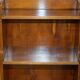 Pair of vintage English hardwood bookcases in a cascade style with cupboards.