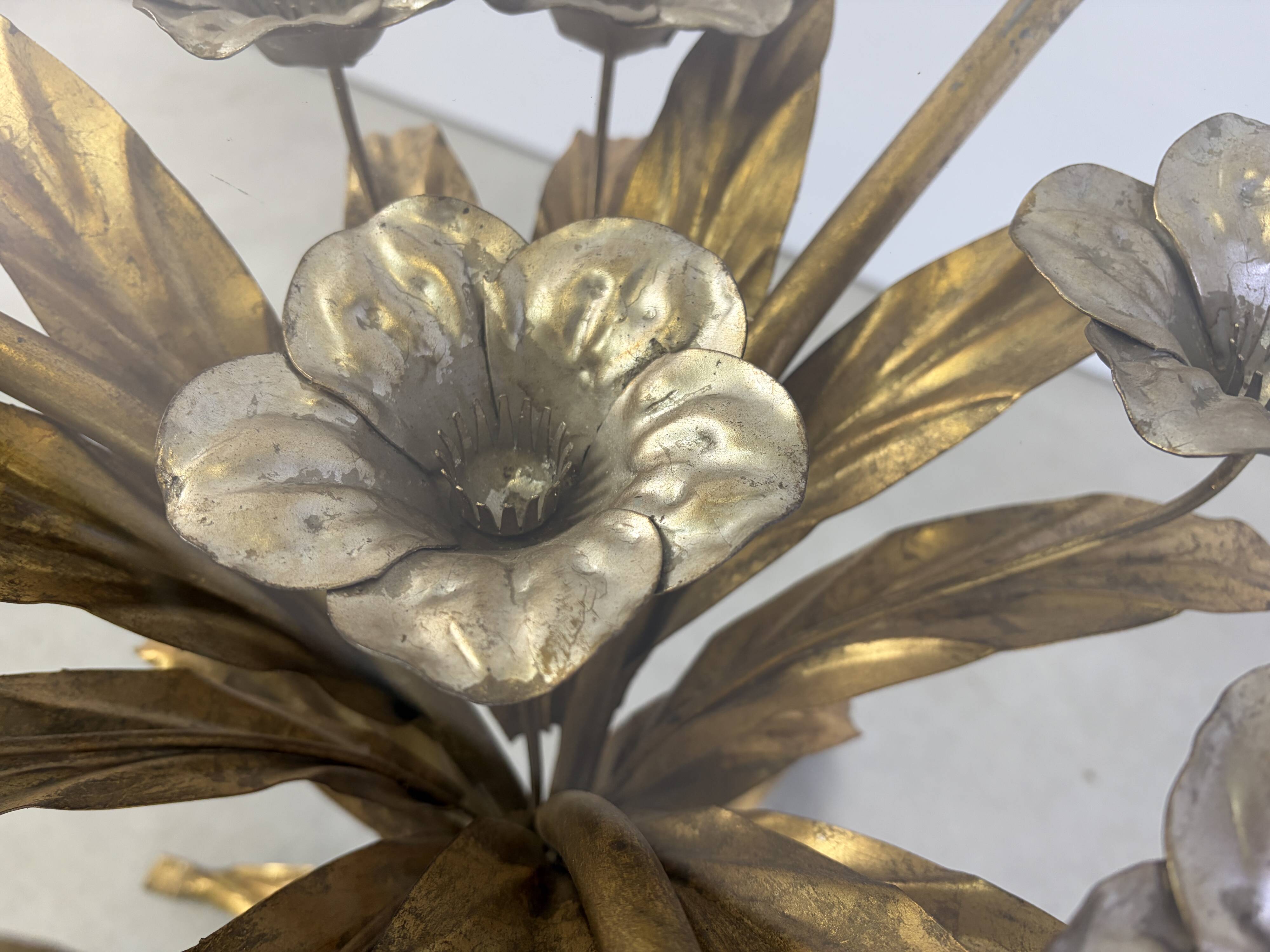 Charming metal flower coffee table or side table with a clear glass top. Made in Italy, attributed to Hans Kögl.