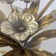 Charming metal flower coffee table or side table with a clear glass top. Made in Italy, attributed to Hans Kögl.