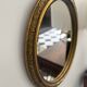 Oval gold mirror in Napoléon III style