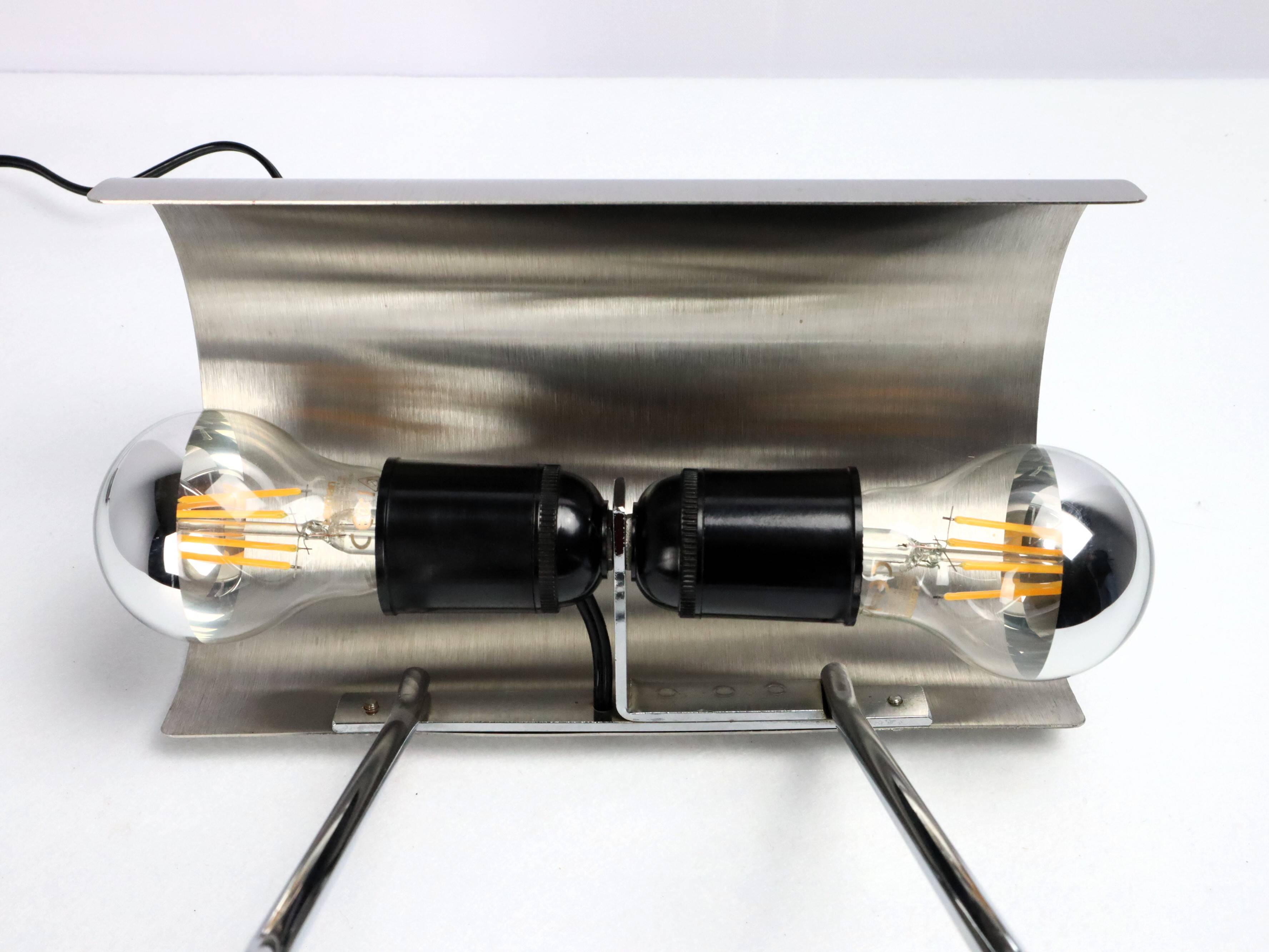 Stainless steel lamp from the 1970s in the style of François Monnet.