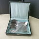Box of 12 teaspoons in silver metal beaded decoration