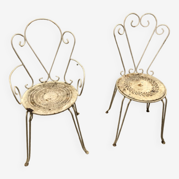 Two wrought iron garden chairs