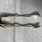 Engraved sugar tongs in solid silver with Minerva hallmark and lion's claws
