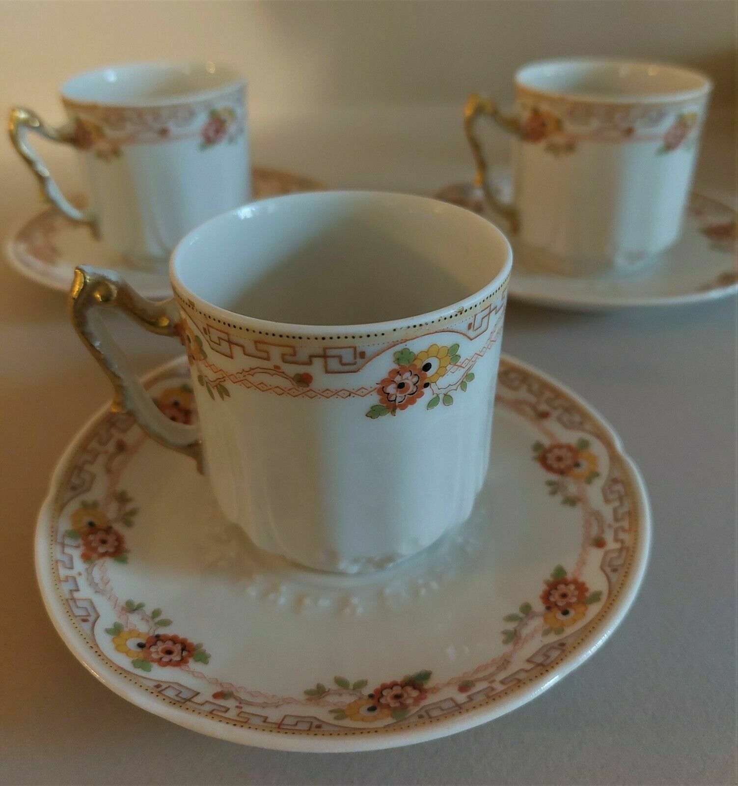 Porcelain cups UC Limoges, series of three