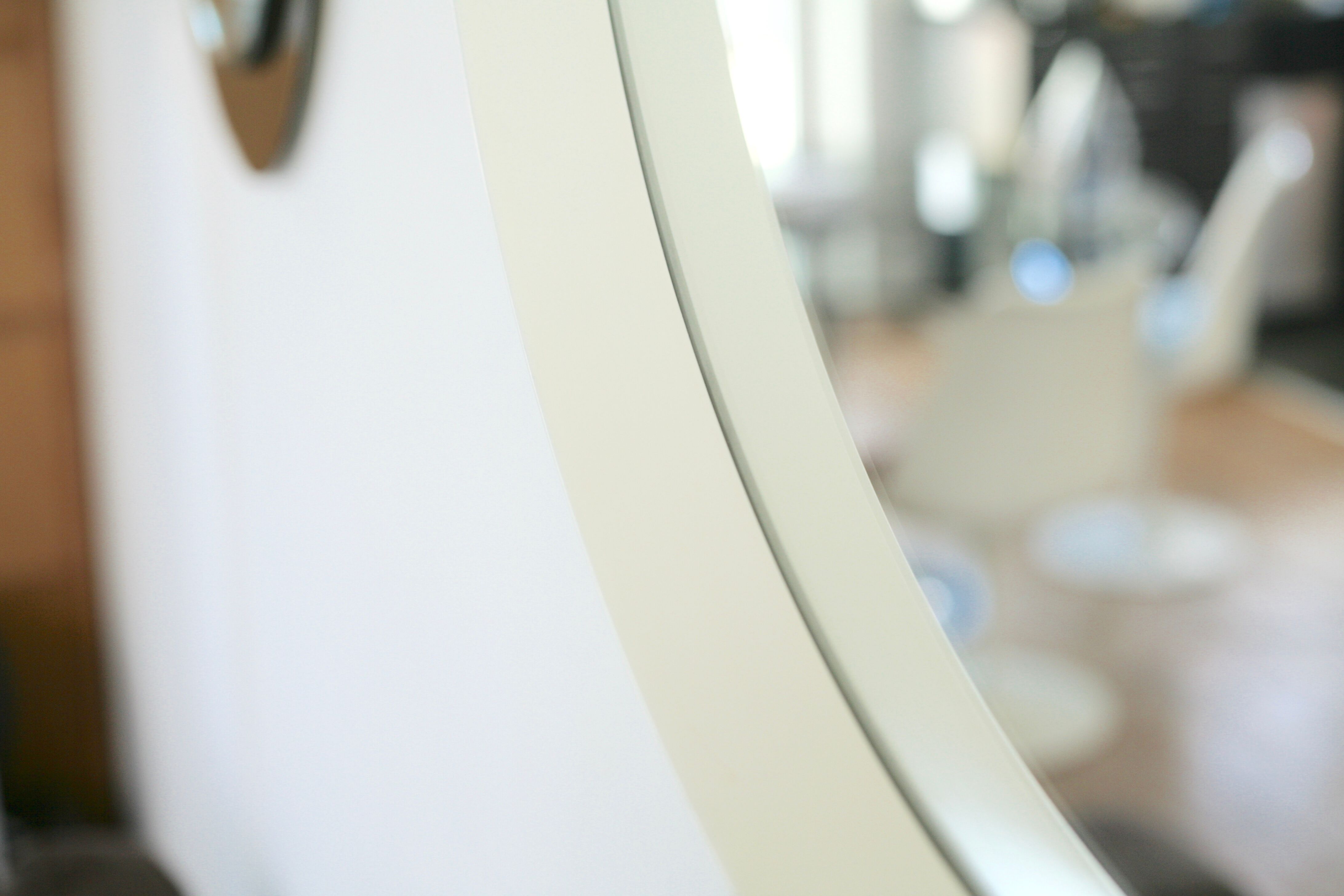 Circular mirror in "cream" laqué wood France circa 1960 68cm