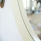 Circular mirror in "cream" laqué wood France circa 1960 68cm
