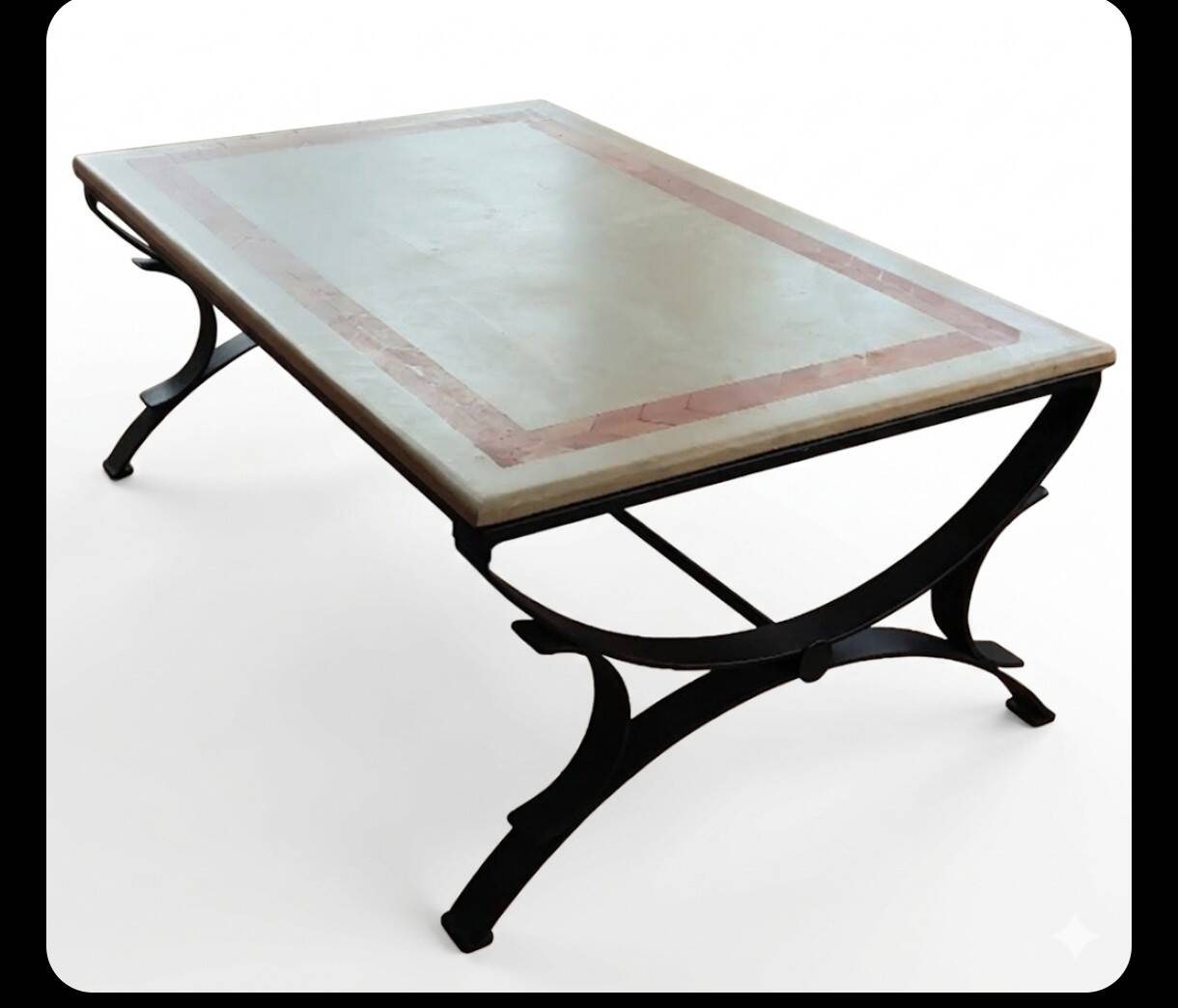 Rectangular coffee table with a stone top on wrought iron.