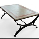 Rectangular coffee table with a stone top on wrought iron.