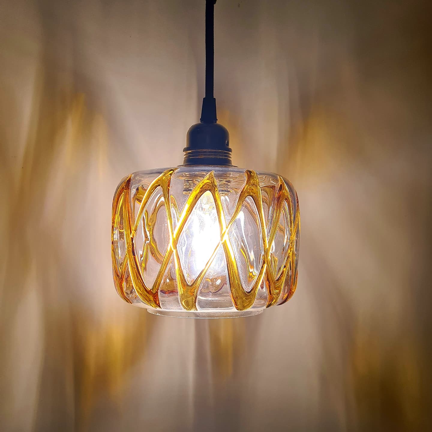 Amber blown glass suspension