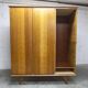French wardrobe with tapered legs, 3 doors, 1 mirror (27*130), and 1 drawer.