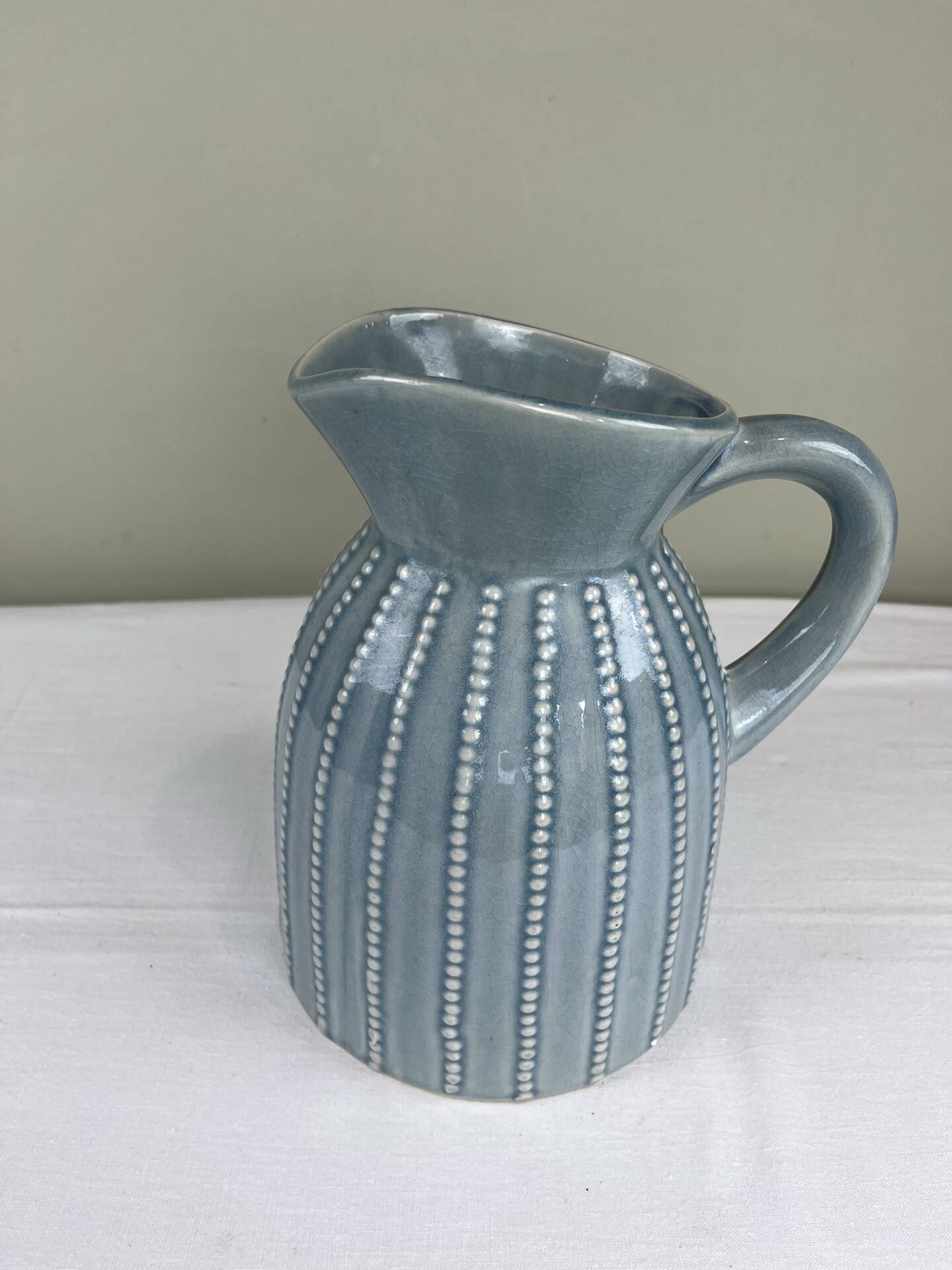 Large vintage pitcher in crackled celadon ceramic, beaded decoration.