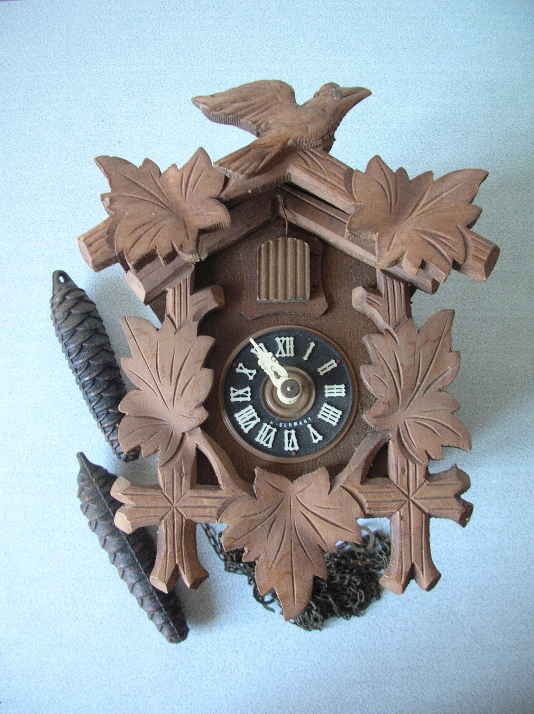 Old mechanical cuckoo regula wooden weight pine cone clock pendulum