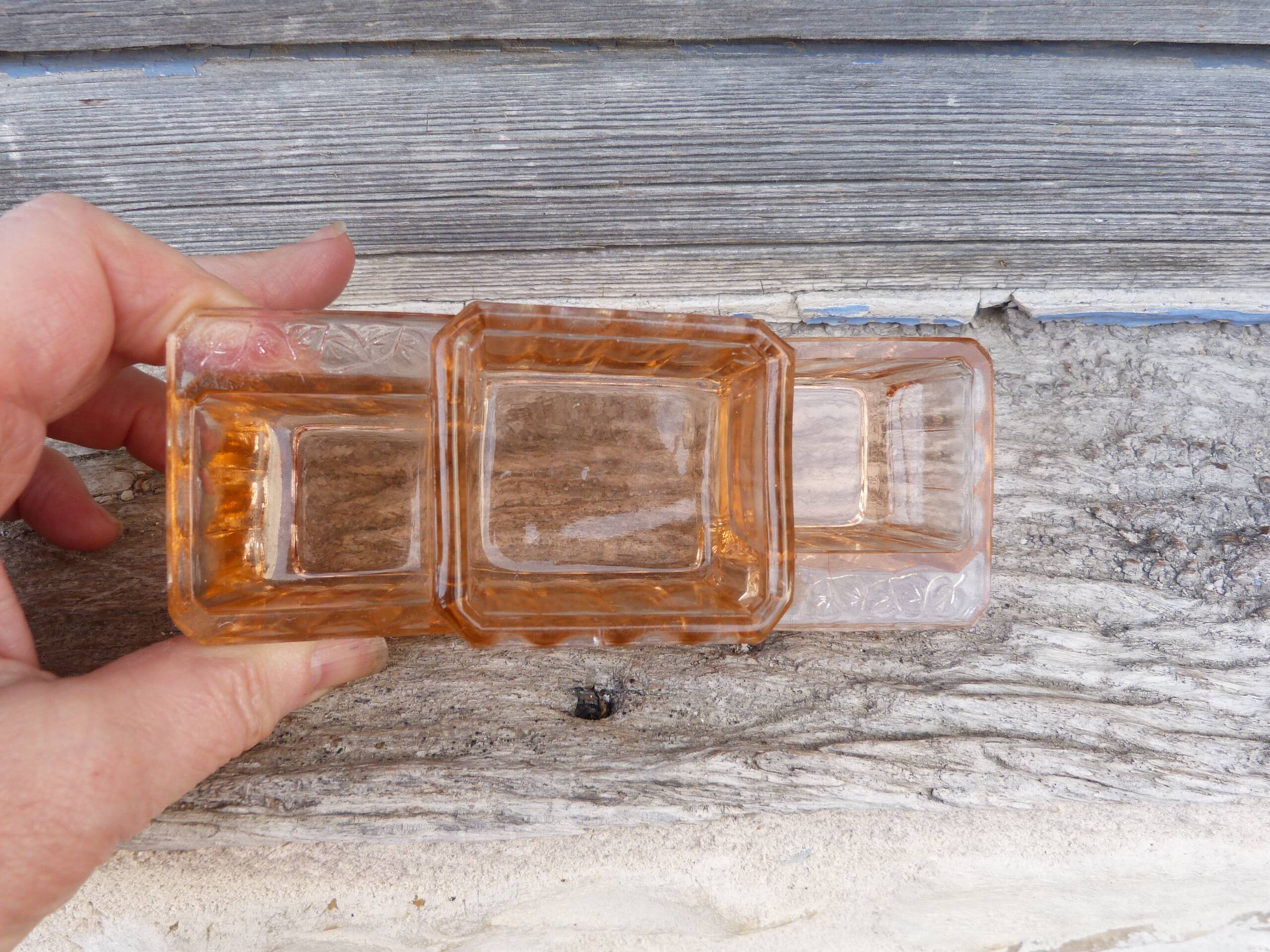 Glass condiment service in transparent pink moulded glass.