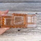 Glass condiment service in transparent pink moulded glass.