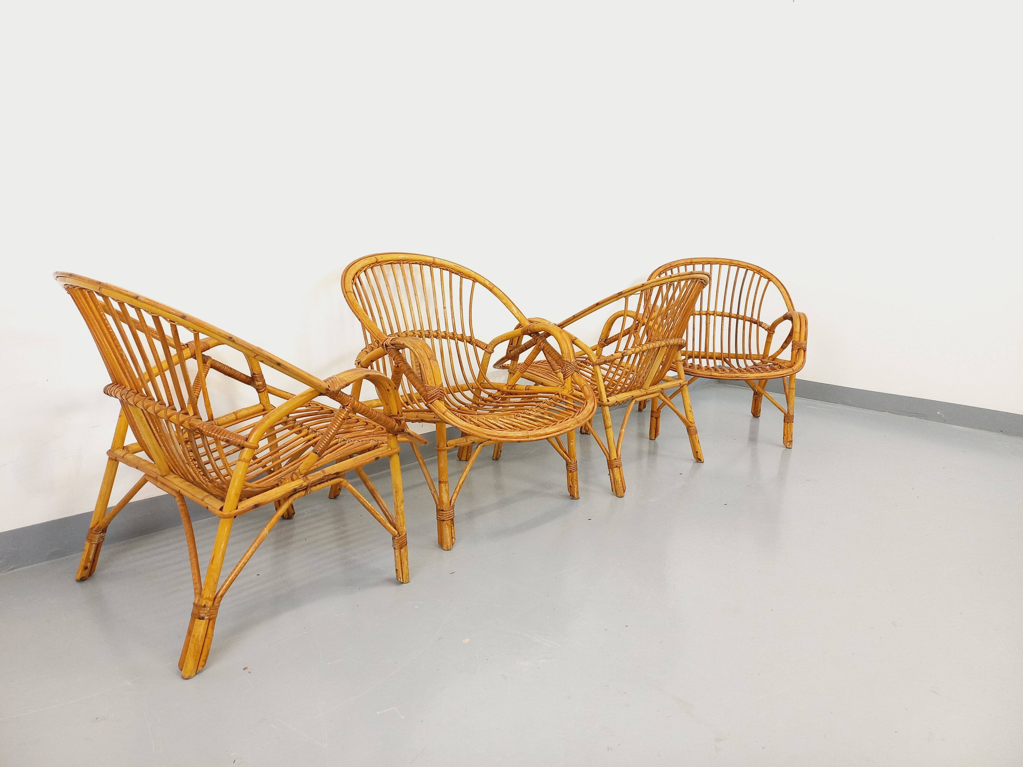 Set of 4 vintage rattan armchairs from the 60s