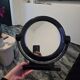 Vintage round pivoting mirror in black, retro style from the 70s/80s.