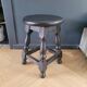 Antique wooden stool with turned legs.