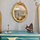 Miroir oval en bois doré 70x49cm