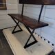 Old garden bench with iron legs and wooden seats