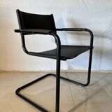 Set of 12 vintage chairs in black leather and tubular steel – Italy, 1970s