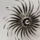Silver wrought iron sunburst wall light from the 1960s.