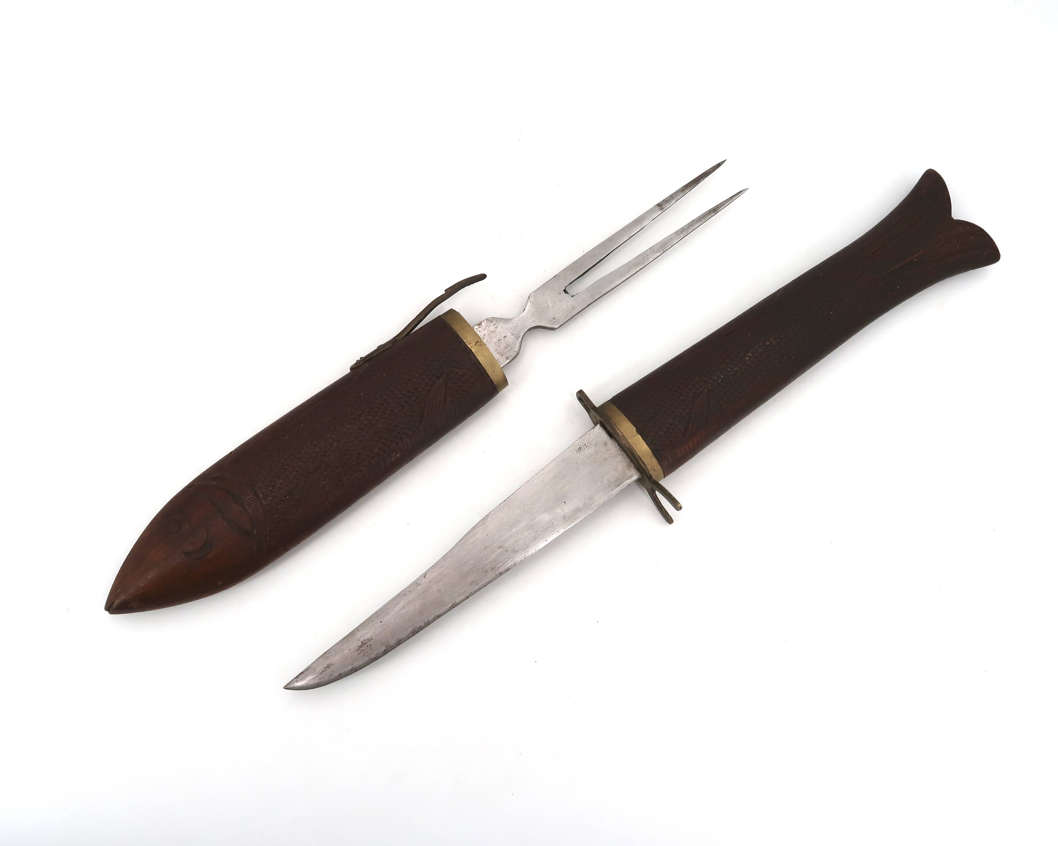 Fish knife and fork with a wooden and brass sheath sculpture.