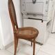 Antique chair Louis XVI style, seat caned, carved wood