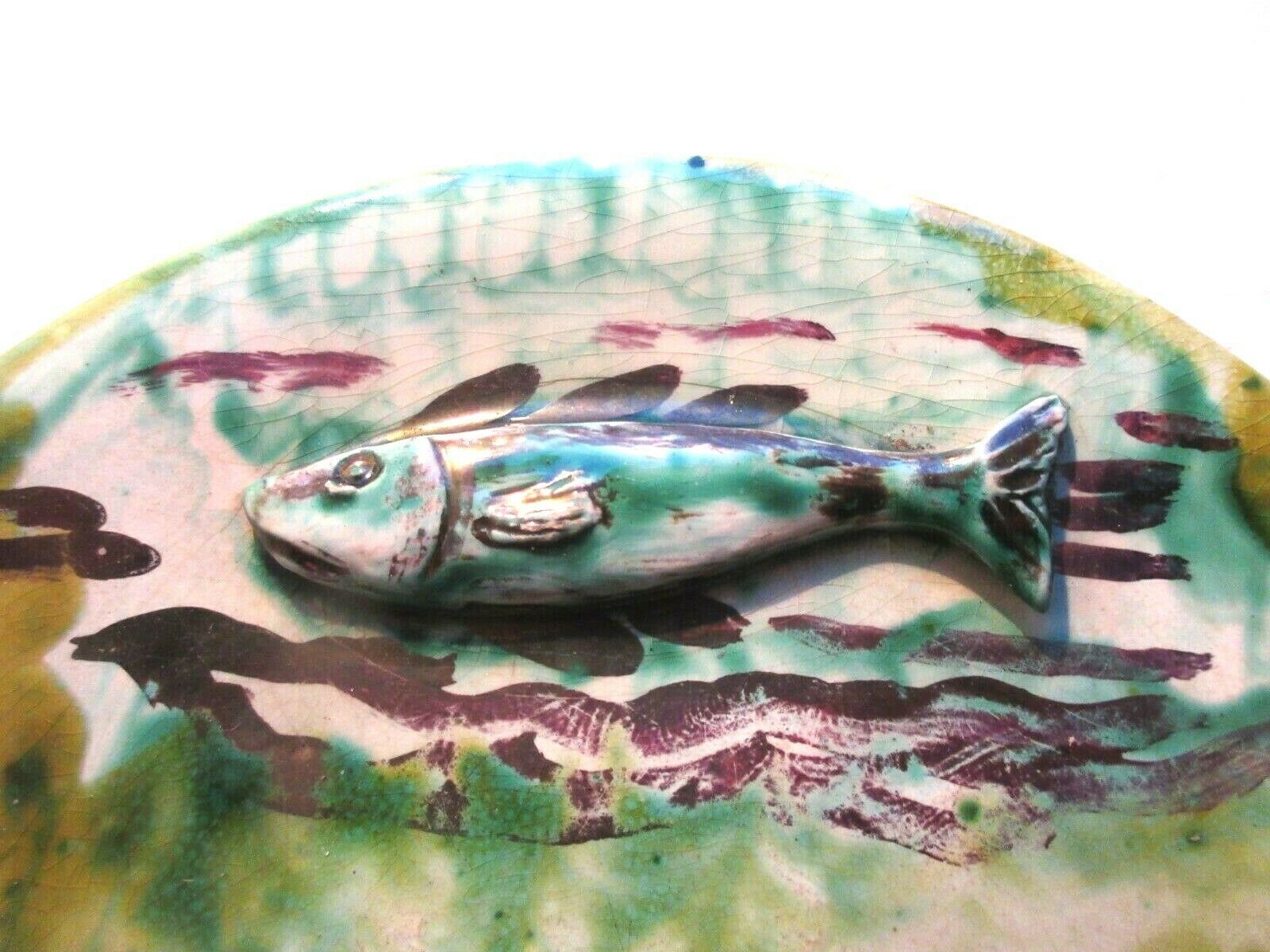 Dabbling plate with trompe l'oeil fish, signed sp,