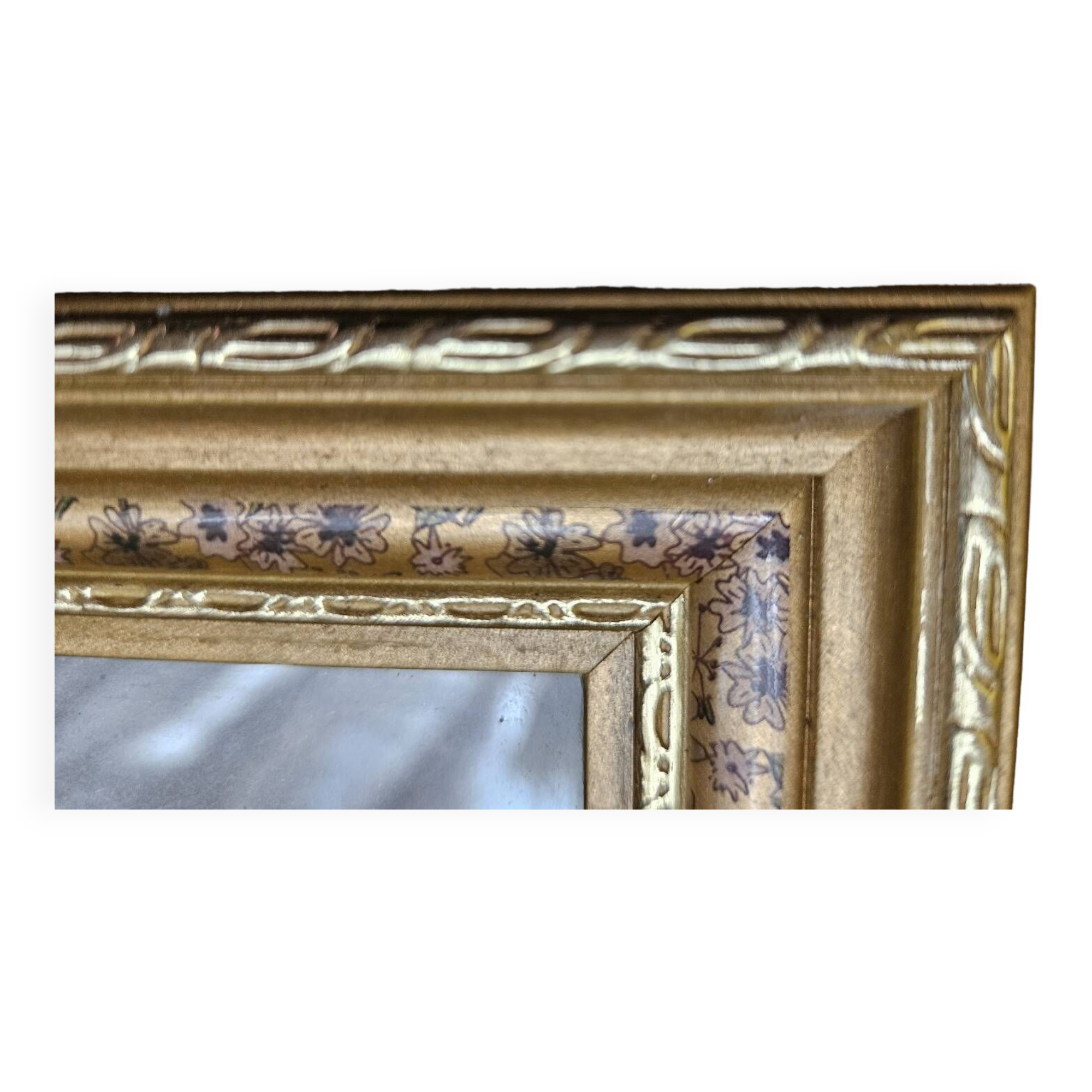 Golden wooden frame with floral patterns