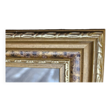 Golden wooden frame with floral patterns