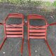 2 red metal Tolix-style chairs, France 1950