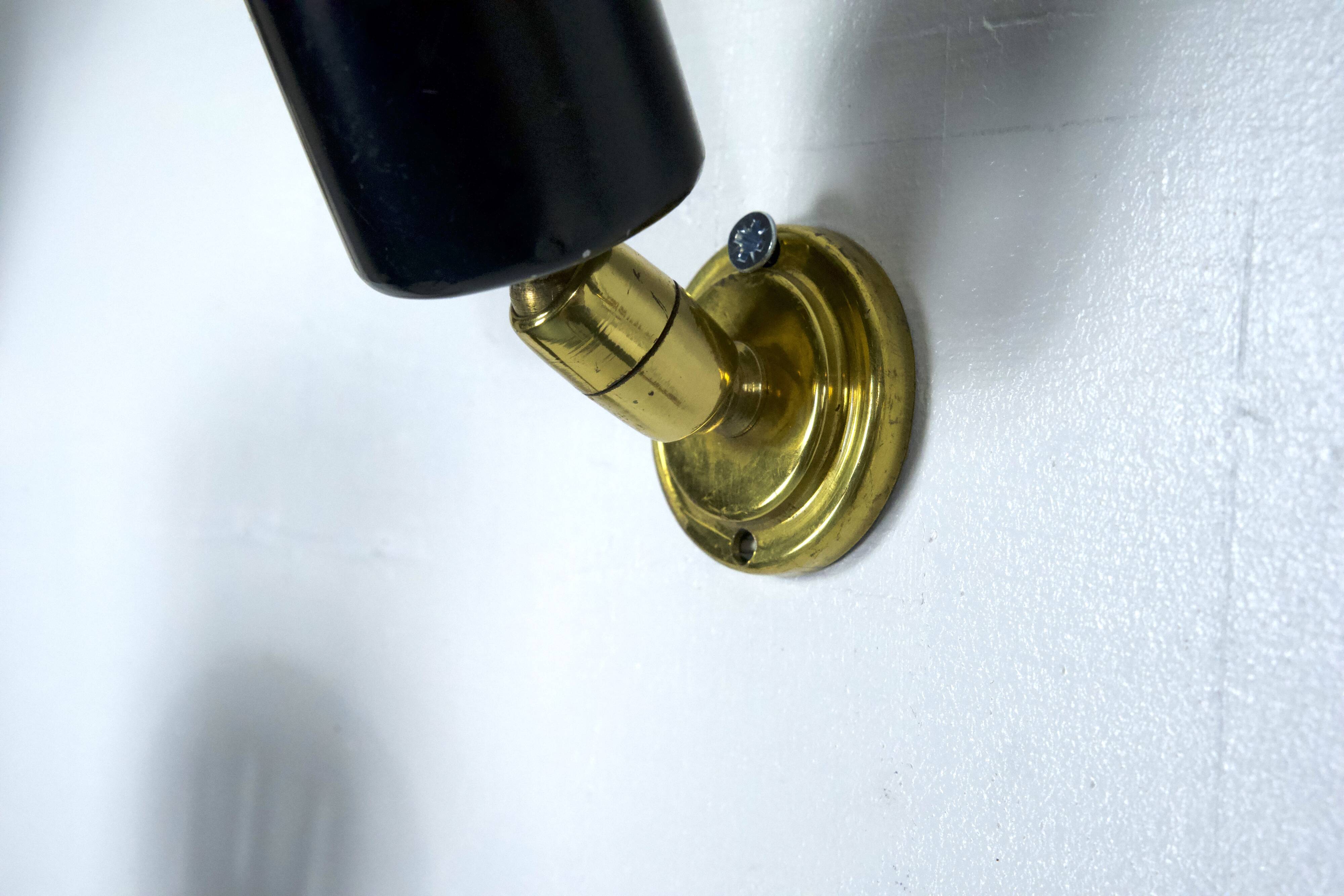 Set of five Stilnovo style spotlights in brass and lacquered metal. Italy