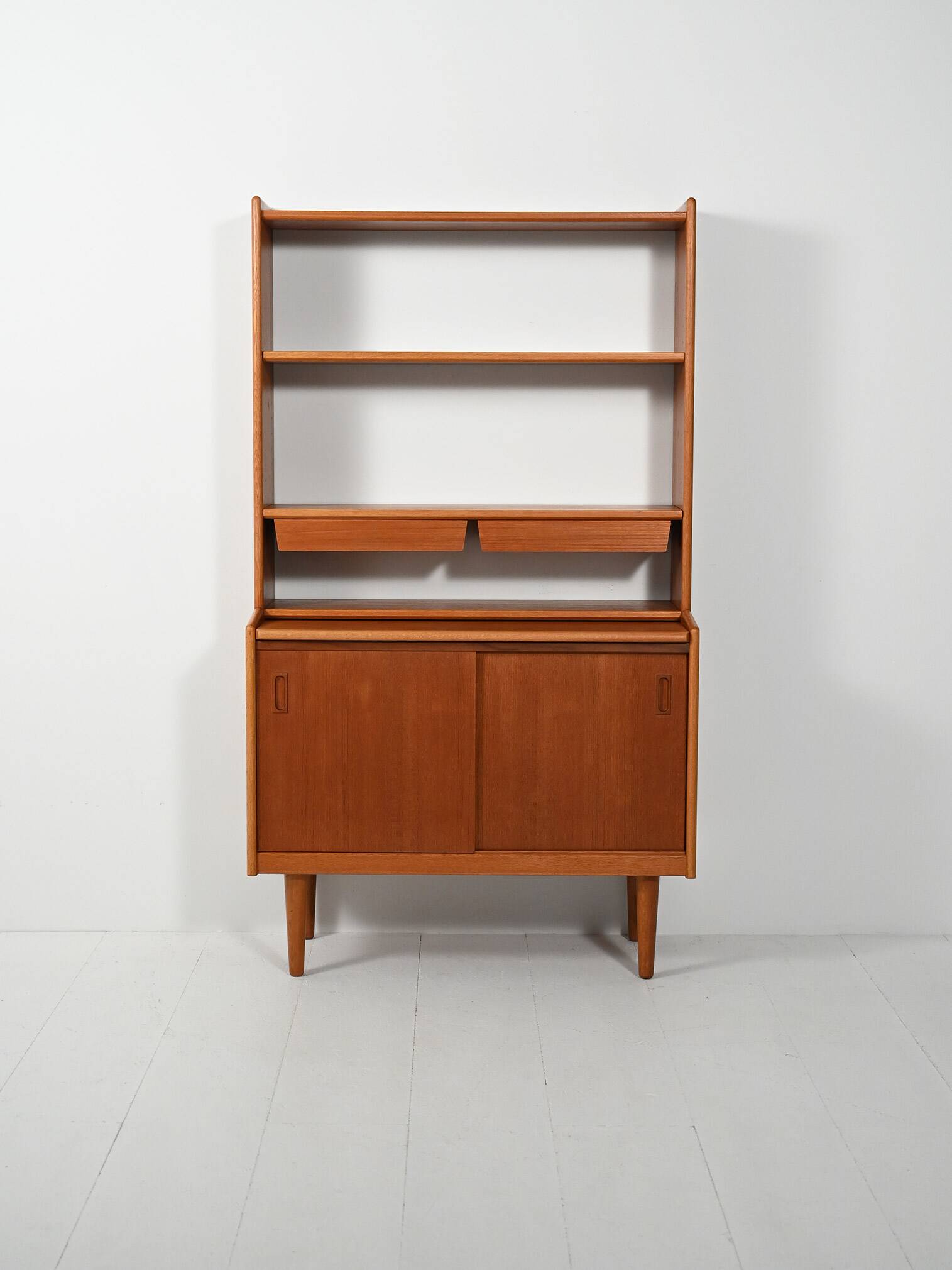 Scandinavian teak bookcase with suspended drawers