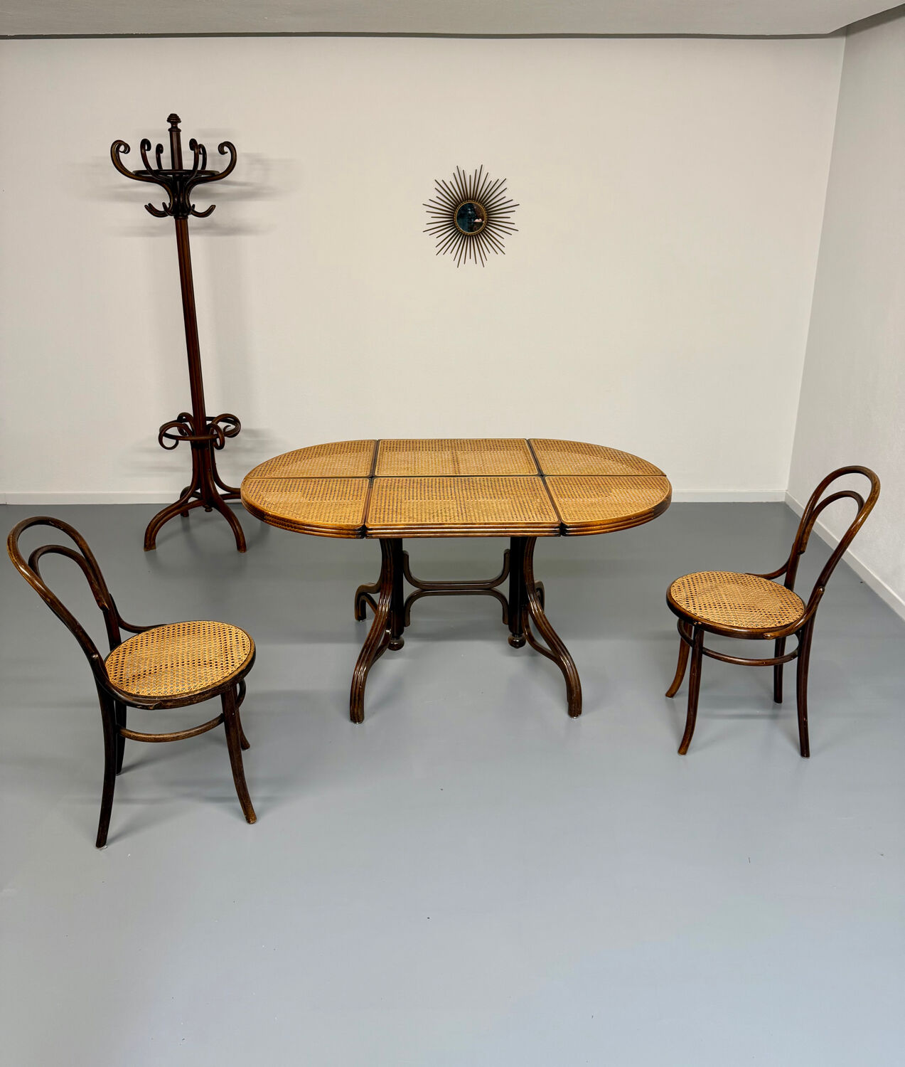 Vintage dining table with a cane top by Mundus from the 1970s.