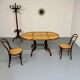 Vintage dining table with a cane top by Mundus from the 1970s.