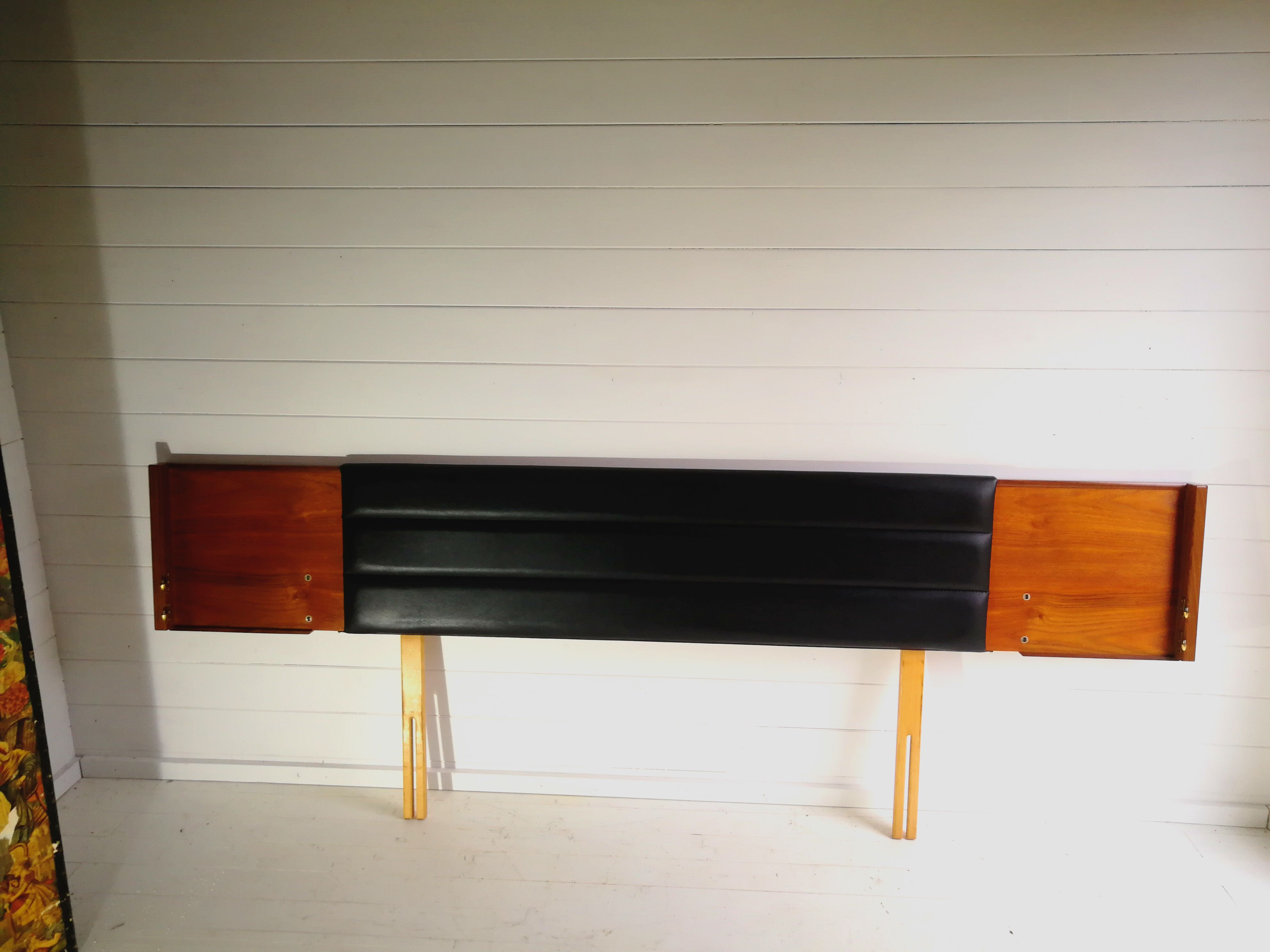 Mid century 1970s retro teak headboard with two hinged bedsides, upholstered in black by 'slumberlan