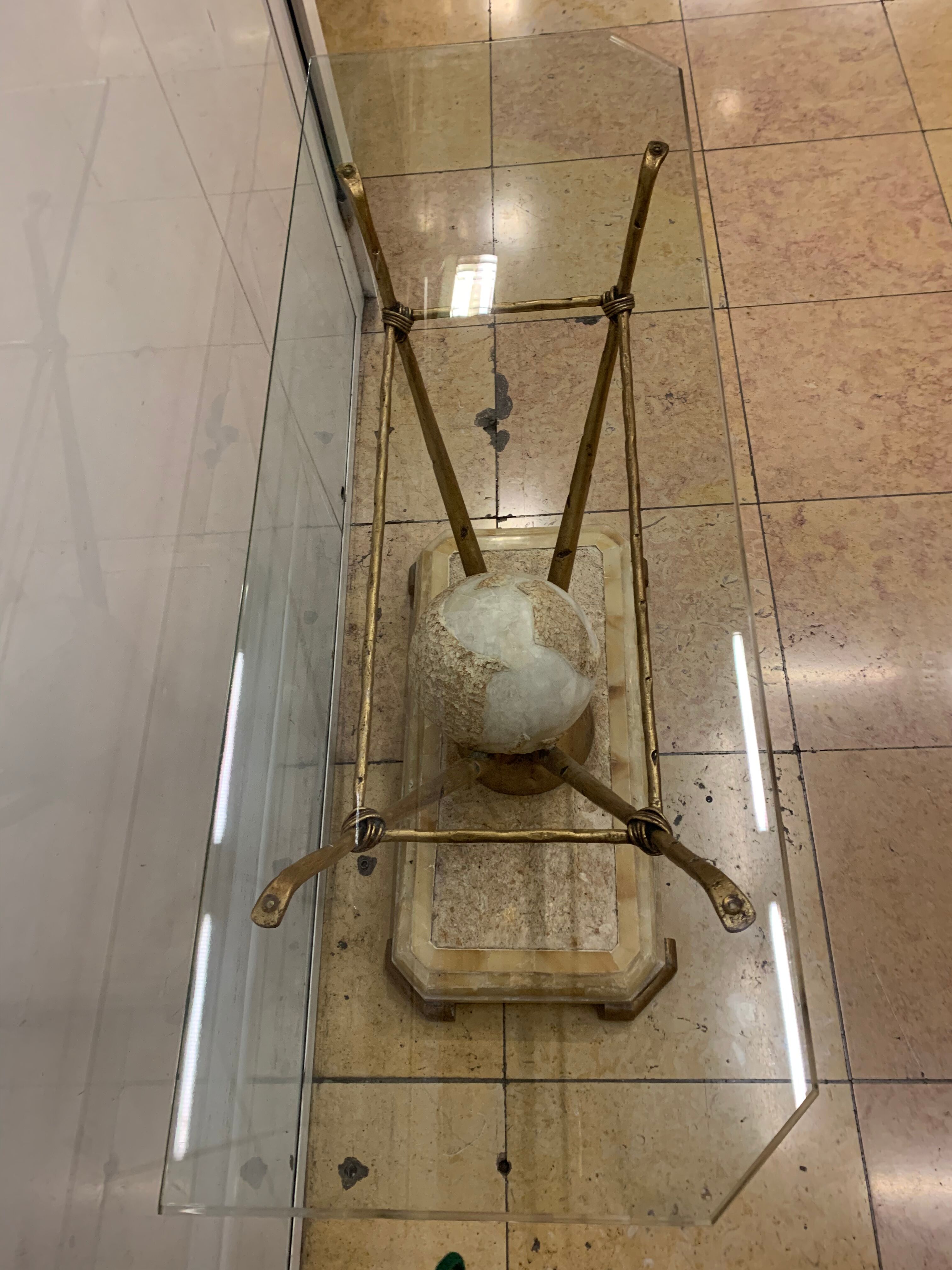 Travertine console from Fournier Paris over glass