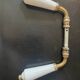 pair of Limoges porcelain handle levers UCDA and l