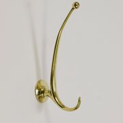 Two curved wall coat racks in brass by Franz Hagenauer, Vienna, mid-20th century, 1950s.