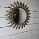 Witch's eye sun mirror in gold metal from the 60s