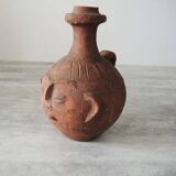 Old anthropomorphic terracotta vase pitcher