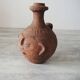 Old anthropomorphic terracotta vase pitcher