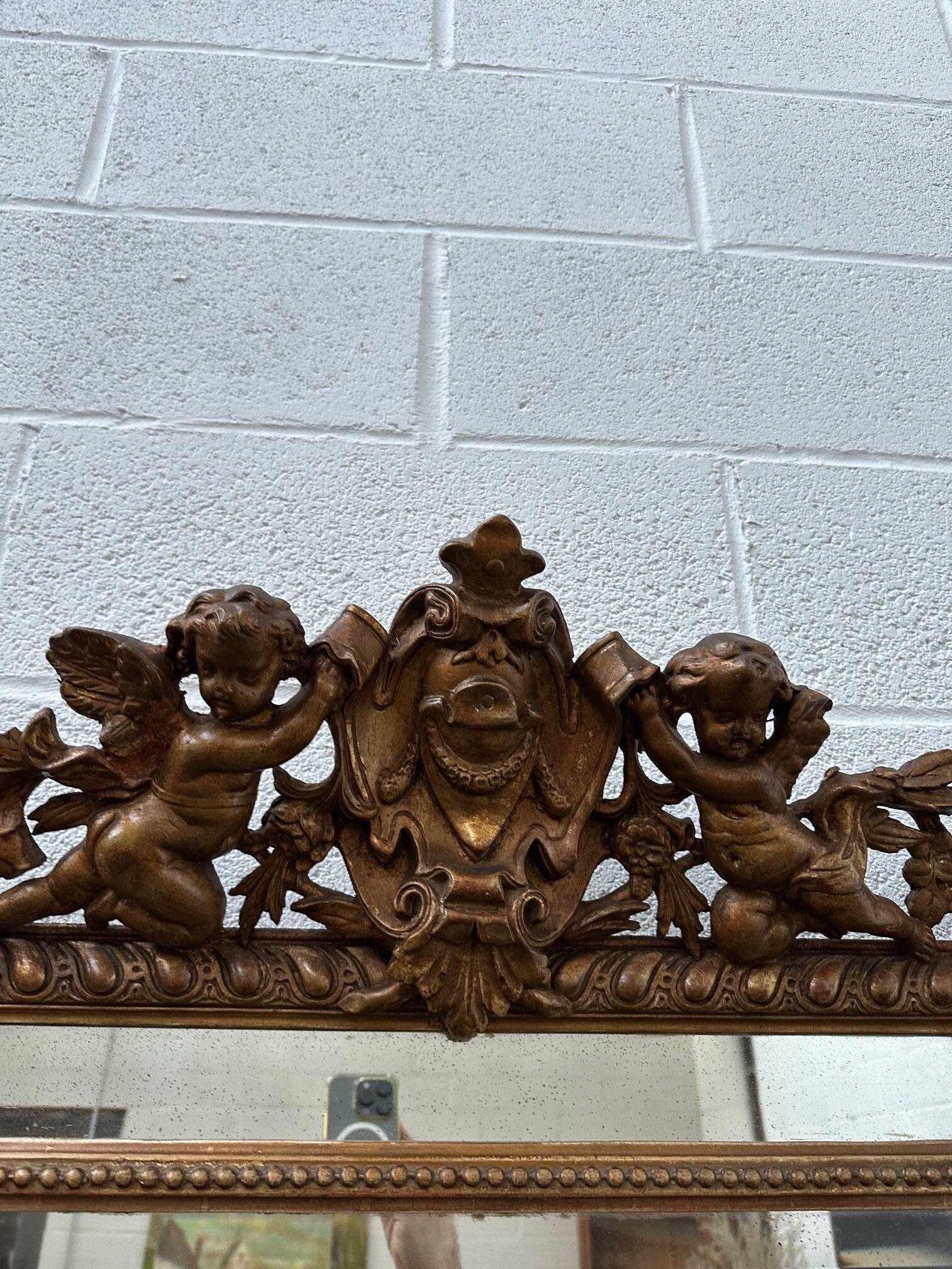 19th century mirror with cherubs