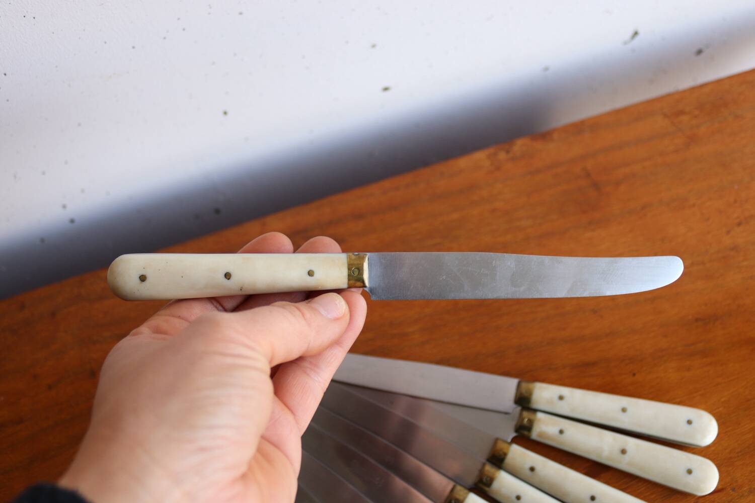Set of 9 vintage cream table knives