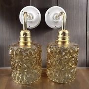 Paire d’appliques murales en verre doré