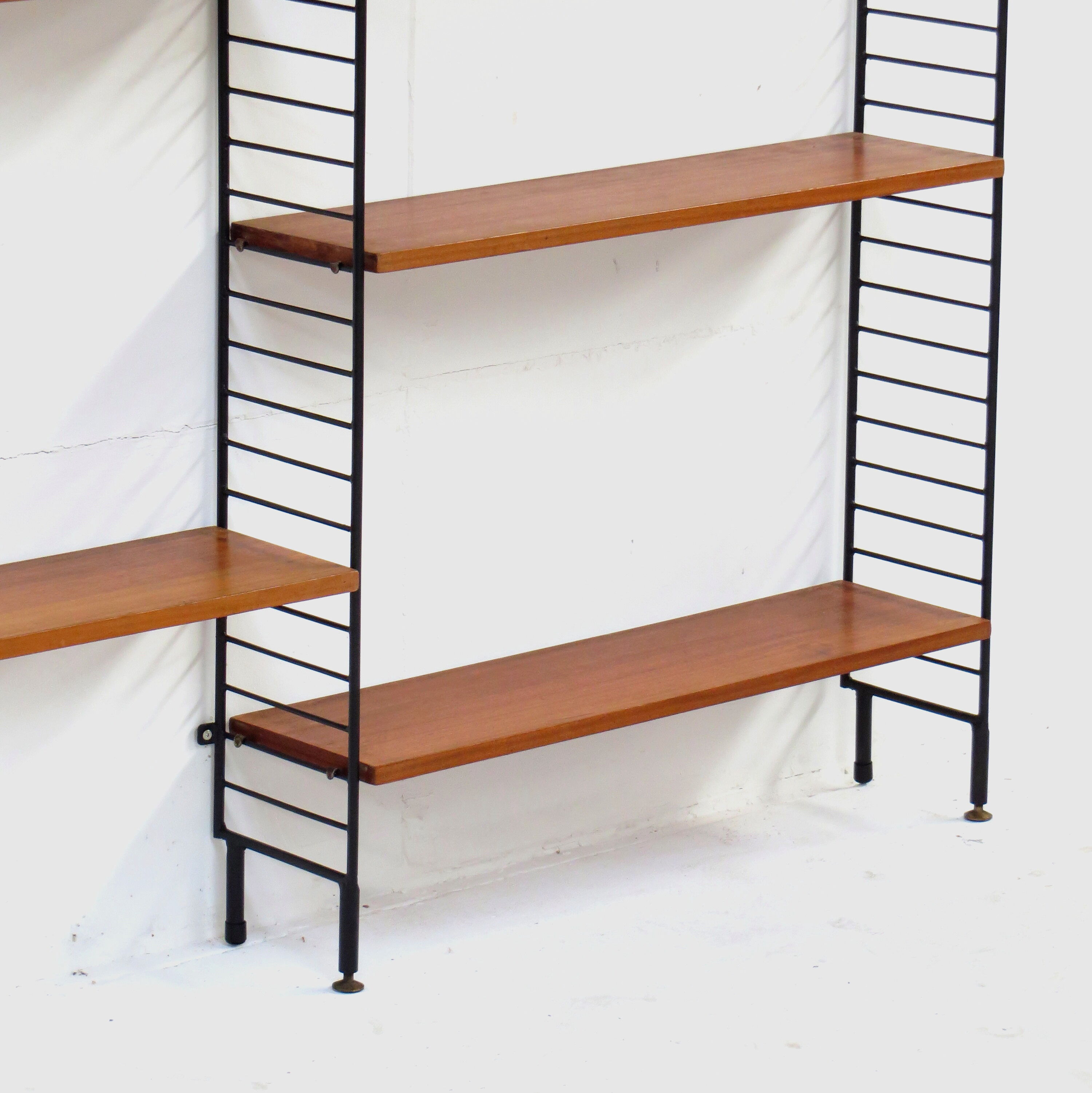 Mid century Wall Unit Shelving System in teak with black metal bookshelf supports